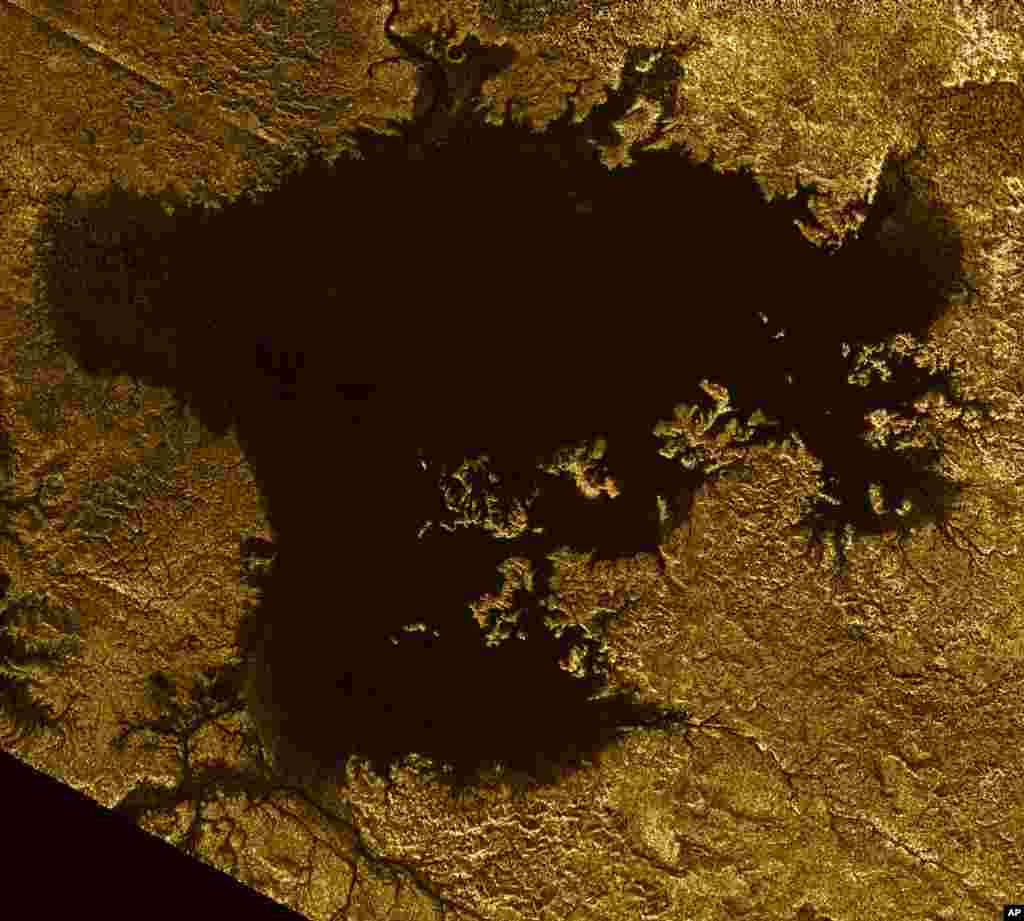 This 2007 image made available by NASA shows a hydrocarbon sea named Ligeia Mare on Saturn's moon Titan, as seen by the Cassini spacecraft. 