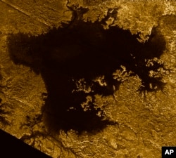 This 2007 image made available by NASA shows a hydrocarbon sea named Ligeia Mare on Saturn's moon Titan, as seen by the Cassini spacecraft.