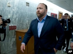 FILE - Conspiracy theorist Alex Jones is pictured on Capitol Hill in Washington after he listened to testimony to lawmakers, Sept. 5, 2018. On Oct. 23, 2018, Twitter confirmed it had removed accounts linked to Jones and the Infowars website.