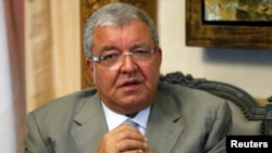Lebanon's Interior Minister Nouhad Machnouk speaks during an interview with Reuters at his office in Beirut, July 9, 2014. 