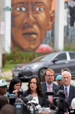 Baltimore State's Attorney Marilyn Mosby, center, holds a news conference near the site where Freddie Gray was arrested after her office dropped the remaining charges against three Baltimore police officers awaiting trial in Gray's death, in Baltimore, July 27, 2016.