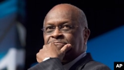 FILE - Herman Cain attends the Faith and Freedom Coalition's Road to Majority event in Washington, June 20, 2014.