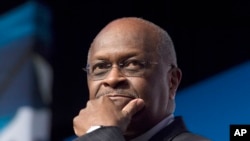 FILE - Herman Cain speaks during Faith and Freedom Coalition's Road to Majority event in Washington, June 20, 2014.
