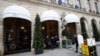 People enter the Ritz hotel in Paris, Jan. 11, 2018. Paris police have recovered some jewels stolen from the Ritz Hotel in a multimillion-euro robbery attempt, but are still searching Thursday for two thieves and the rest of the missing luxury merchandise.