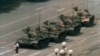 A man stands alone to block a line of tanks heading east on Beijing's Cangan Blvd. in Tiananmen Square, June 5, 1989.