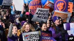 Pro-abortion rights protesters rally outside the Supreme Court in Washington, March 2, 2016. The abortion debate is returning to the high court in the midst of a raucous presidential campaign and less than three weeks after Justice Antonin Scalia’s death.