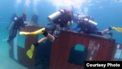 A shipping container was dropped in the coast of Sihanoukville to create artificial coral reefs. (Courtesy of National Committee For Maritime Security)