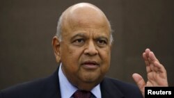 South African Finance Minister Pravin Gordhan reacts during a media briefing in Sandton near Johannesburg March 14, 2016. 