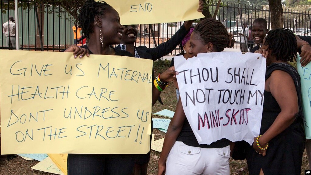 FILE - Women protest against dress code legislation, Feb. 26, 2014, in Kampala, Uganda. This week, the country's goverment introduced a new dress code for civil servants. 