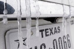 Icicles hang on the back of a vehicle Monday, Feb. 15, 2021, in Houston.