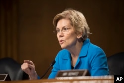 Sen. Elizabeth Warren, D-Mass., questions Federal Reserve Chairman Jerome Powell during hearing of the Senate Banking, Housing and Urban Affairs Committee, Feb. 26, 2019 in Washington.