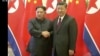 North Korean leader Kim Jong Un shakes hands with Chinese President Xi Jinping, in this still image taken from video released March 28, 2018. 