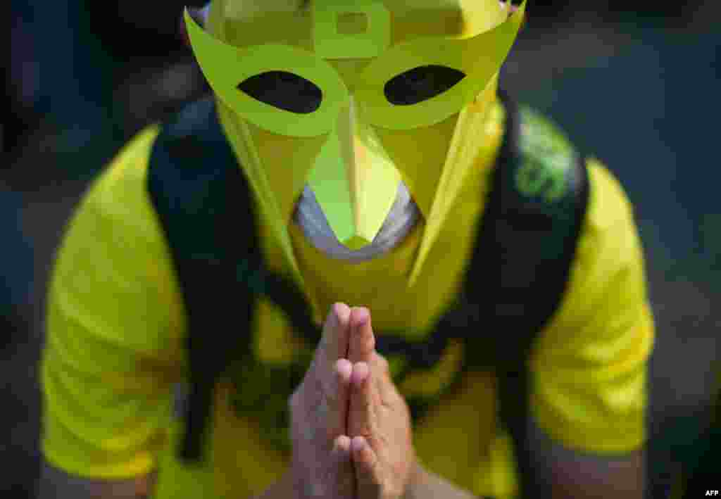 A protester offers prayers on the second day of a demonstration demanding Prime Minister Najib Razak&rsquo;s resignation and electoral reforms in Kuala Lumpur. Tens of thousands of Malaysians swarmed central Kuala Lumpur to call for the prime minister&#39;s ouster over corruption allegations and demand broader reforms, defying warnings by police who had declared the rally illegal.