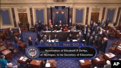 Vice President Mike Pence presides over the Senate on Capitol Hill in Washington, Feb. 7, 2017, during the Senate's vote on Education Secretary-designate Betsy DeVos.