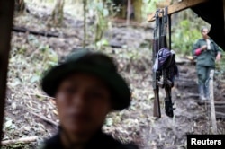 FILE - Weapons are seen at a camp of the 51st Front of the Revolutionary Armed Forces of Colombia (FARC) in Cordillera Oriental, Colombia, Aug. 16, 2016.