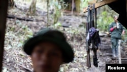 FILE - Weapons are seen at a camp of the 51st Front of the Revolutionary Armed Forces of Colombia (FARC) in Cordillera Oriental, Colombia, Aug. 16, 2016.