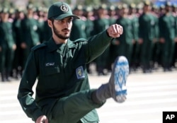 FILE - An Iranian officer of the Revolutionary Guards is shown during a graduation ceremony for military cadets in Tehran, Iran, June 30, 2018.
