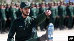 FILE - An Iranian Officer of Revolutionary Guards,is is shown during graduation ceremony, held for the military cadets in a military academy, in Tehran, Iran, June 30, 2018.