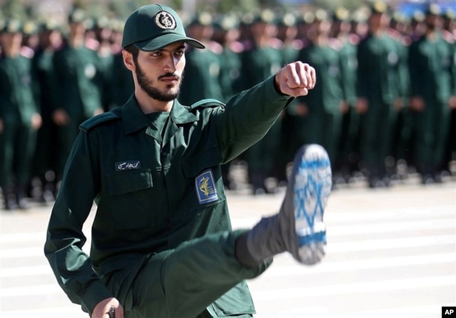 FILE - An Iranian officer of the Revolutionary Guards is shown during a graduation ceremony for military cadets in Tehran, Iran, June 30, 2018.