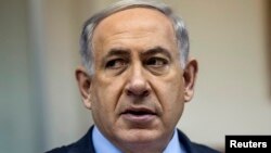 FILE - Israel's Prime Minister Benjamin Netanyahu attends the weekly cabinet meeting at his office in Jerusalem, Dec. 14, 2014. 