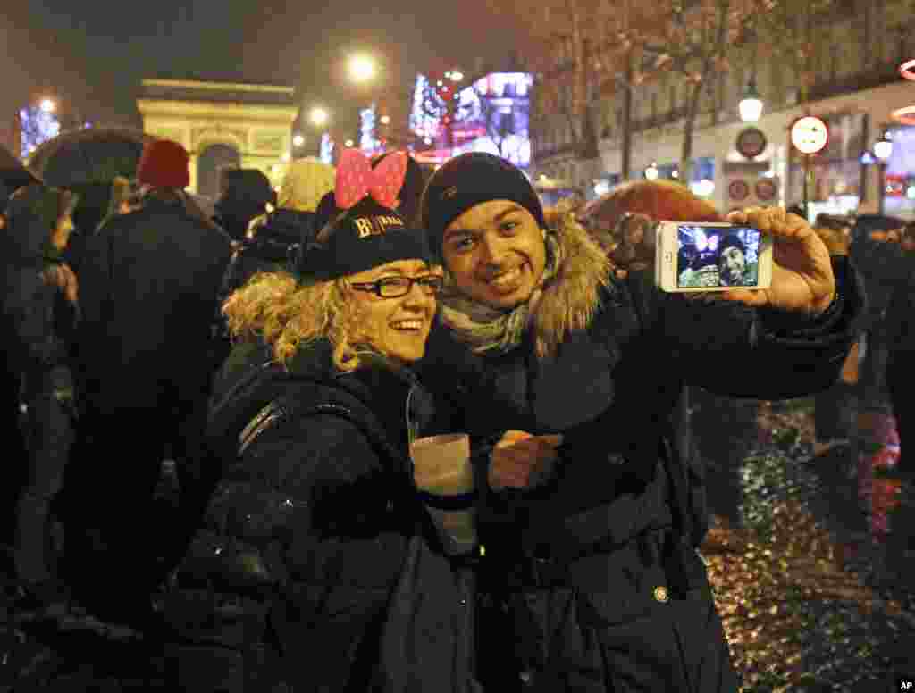 Revelers celebrate the New Year on the Champs Elysee in Paris, Jan. 1, 2013.