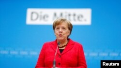 German Chancellor Angela Merkel gives a statement at the Christian Democratic Union (CDU) headquarters in Berlin, Germany, March 5, 2018.