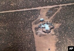 FILE - This Aug. 3, 2018, file photo released by Taos County Sheriff's Office, shows a rural compound in Amalia, N.M.