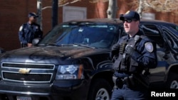 Homeland Security officers stand guard outside of John Joseph Moakley United States Courthouse in Boston, Massachusetts May 1, 2013. 