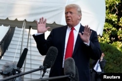 President Donald Trump talks to reporters on the South Lawn of the White House in Washington, before leaving for Wheeling, W.Va., Sept. 29, 2018.