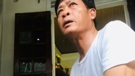 Pham Van Thin, father of Pham Thi Tra My, a suspected victim of 39 deaths on a truck container in UK, sits at home in Ha Tinh province, Vietnam October 27, 2019. REUTERS/Kham