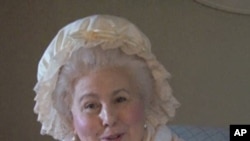 A woman playing the part of Martha Washington talks to visitors at Mt. Vernon.