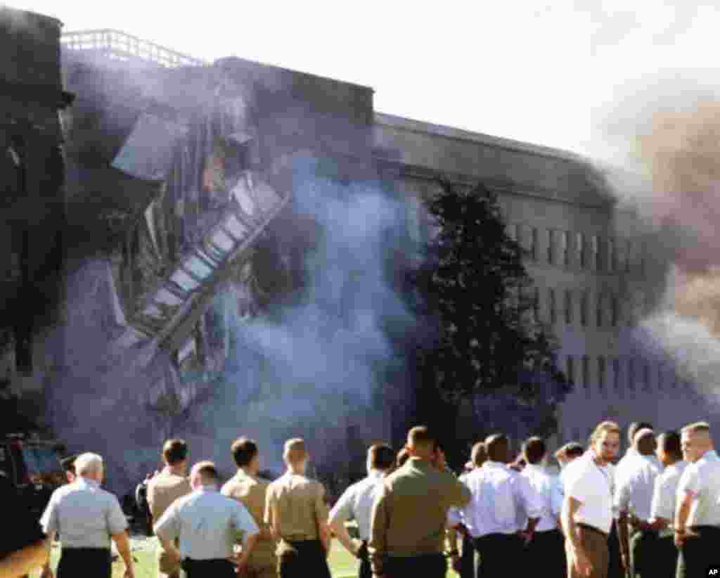 The Pentagon is seen Tuesday, Sept. 11, 2001, after a direct devastating hit on the building by an aircraft. (AP Photo/ Hillery Smith Garrison)