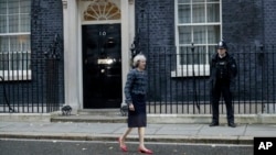 FILE - British Prime Minister Theresa May is seen walking outside 10 Downing Street in London, Nov. 9, 2016. 