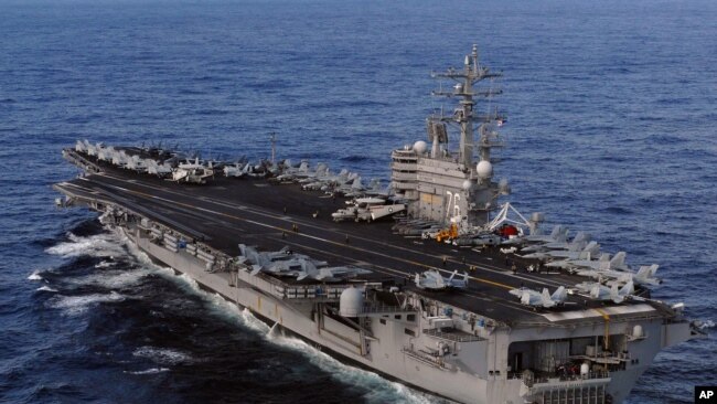 This image provided by the U.S. Navy shows the Nimitz-class aircraft carrier, USS Ronald Reagan underway in the Pacific Ocean Saturday March 12, 2011 enroute to Japan to render humanitarian assistance and disaster relief. (AP Photo/US Navy - Dylan McCord)