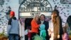 FILE - Counselor to the President Kellyanne Conway and her husband George Conway greet guests on the South Lawn of the White House during a Halloween event welcoming children to trick-or-treat, Oct. 30, 2017. 