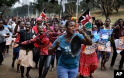 Supporters of opposition leader Raila Odinga celebrate after hearing the verdict on a petition challenging the presidential election result, in Nairobi, Kenya, Sept. 1, 2017.