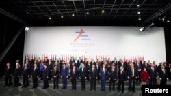 Leaders pose for a group photo during the Asia-Europe summit in Milan, Italy, October 16, 2014.