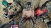 Children suffering from nodding disease gather in Akoya-Lamin Omony village in Gulu district, 384 kilometers north of Uganda's capital of Kampala, February 19, 2012.