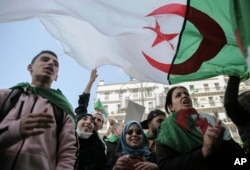 Young people chant slogans during an anti-government demonstration in Algiers, Algeria, April 10, 2019.