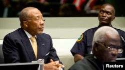 Former Liberian President Charles Taylor appears in court at the Special Court for Sierra Leone for his appeal judgment at The Hague in the Netherlands, Sep. 26, 2013. 