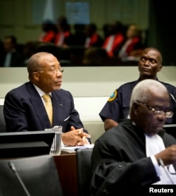 Former Liberian President Charles Taylor appears in court at the Special Court for Sierra Leone for his appeal judgment at The Hague in the Netherlands, Sep. 26, 2013.