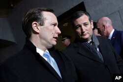FILE - Sen. Ted Cruz, R-Texas, right, arrives on the West Front of the U.S. Capitol on Jan. 20, 2017, in Washington.