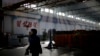 FILE - A North Korean factory worker walks through a processing hall at the Pyongyang 326 Electric Wire Factory, in Pyongyang, North Korea, Jan. 10, 2017. Some 30 African countries maintain economic ties with Pyongyang, despite global condemnation of its regime.