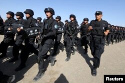 Chinese soldiers participate in an anti-terror drill in Hami, Xinjiang Uighur Autonomous Region, China, July 8, 2017.