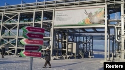 FILE - A general view of a facility at the Russian Trebs and Titov oil fields near the Arctic village of Varandei, Russia, October 2013.