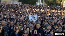 Thousands of bank employees march to the parliament during a protest in Nicosia Mar. 23, 2013.