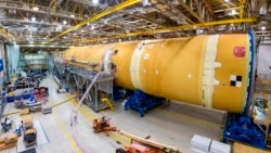 This August 2019 photo released by NASA, shows the core stage for NASA’s Space Launch System (SLS) rocket at the agency’s Michoud Assembly Facility in New Orleans. (Eric Bordelon/NASA via AP)