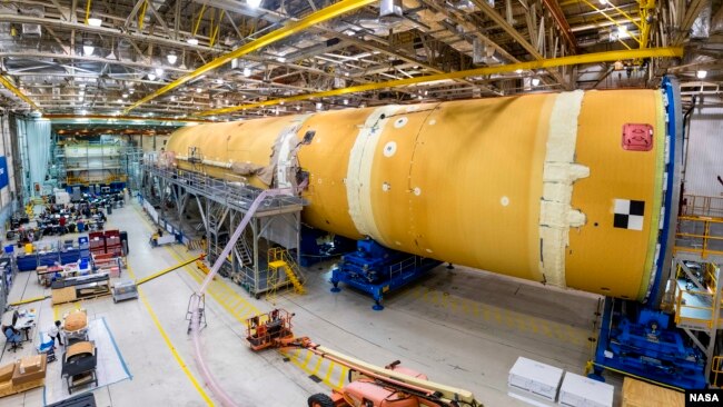 This August 2019 photo released by NASA, shows the core stage for NASA’s Space Launch System (SLS) rocket at the agency’s Michoud Assembly Facility in New Orleans. (Eric Bordelon/NASA via AP)