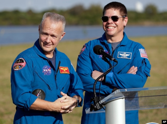 NASA astronauts Doug Hurley, left, and Bob Behnken answer questions during a news conference, March 1, 2019, before the Falcon 9 SpaceX Crew Demo-1 rocket launch at the Kennedy Space Center in Cape Canaveral, Fla. The astronauts are assigned to fly in the