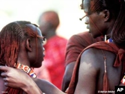 Two young Maasai men in conversation